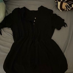 Black dress with 3 buttons. No holes and no stains